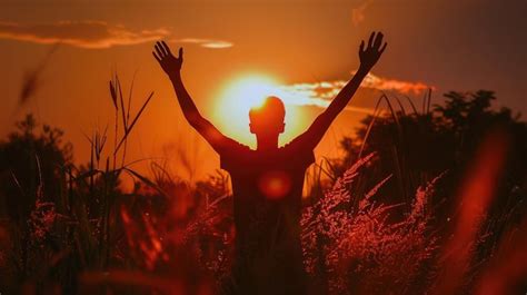 A Moment Of Praise Mans Silhouette With Hands Up Against The Setting
