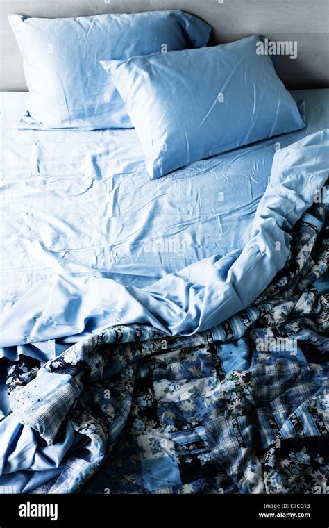Unmade Messy Bed With Wrinkled Sheets From Above Stock Photo Alamy