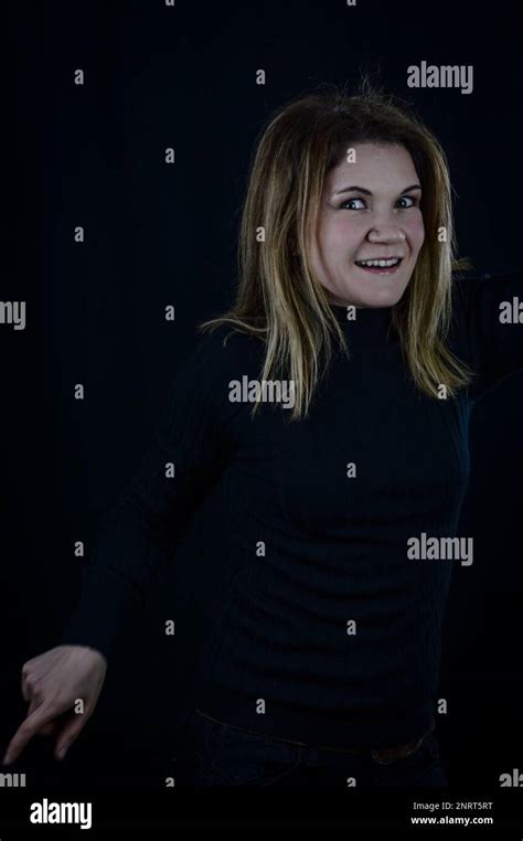 Portrait Of A Beautiful Blonde Having Fun While Dancing Stock Photo Alamy