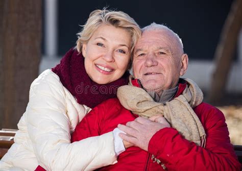 Mature Couple Sitting In Park Stock Photo Image Of Attachment Hands