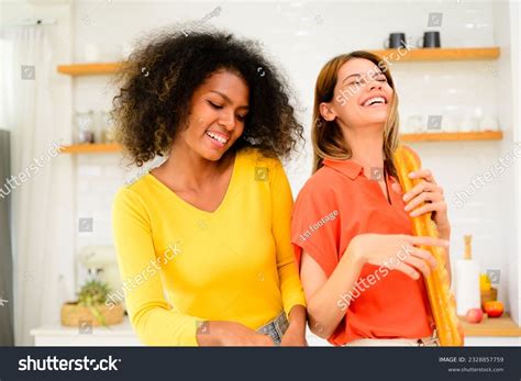 Lesbian Couple Cooking In Kitchen Over Royalty Free Licensable Stock Photos Shutterstock