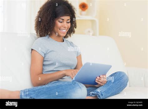 Pretty Brunette Using Tablet Pc Hi Res Stock Photography And Images Alamy