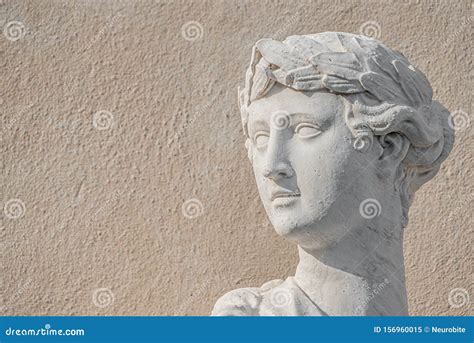 Statue Of Ancient Sensual Half Naked Renaissance Era Woman In Potsdam At Smooth Wall Background