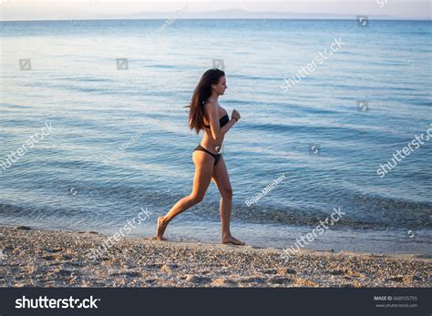 Woman Bikini Running On Beach Stock Photo Shutterstock