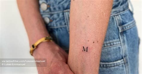 Minimalistic Letter M Tattoo Located On The Inner