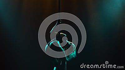 Slim Woman Dancing Striptease And Spinning On A Pole In A Nightclub Beautiful Hot Blonde