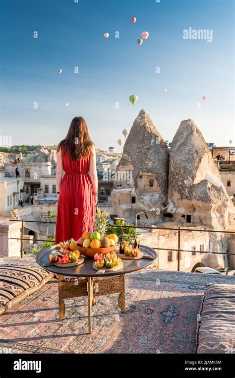 Girl Looking At Hot Air Balloons In Sky Over Cappadocia Stock Photo Alamy