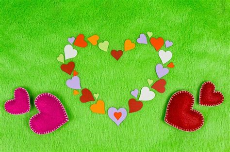 Premium Photo High Angle View Of Heart Shape Objects Against Green