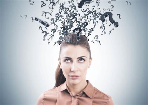 Premium Photo Pensive Woman In Brown Question Marks