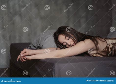 Beautiful Brunette Woman Is Lying On The Bed Face Close Up Beautiful Brown Eyes Lips And