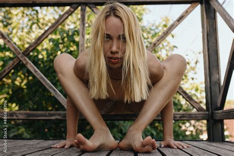 Blonde Woman Doing Yoga Outside In The Nude Clothes Stock Photo Adobe Stock