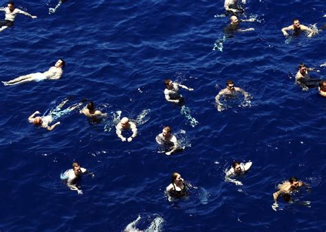People Swimming On Body Of Water During Daytime Free Image Peakpx