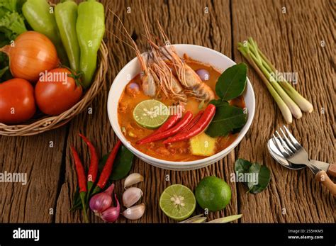 Tom Yum Kung Thai Hot Spicy Soup Shrimp With Lemon Grass Lemon Galangal And Chilli On Wooden