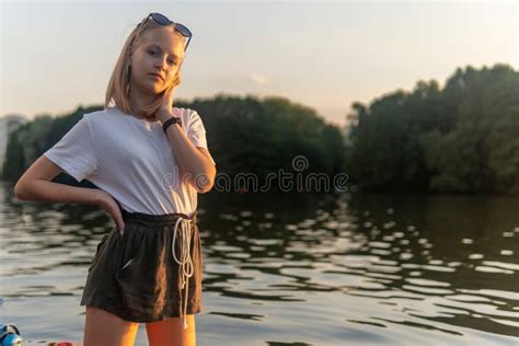 Blonde Teen Girl Standing On The Lake At Sunset Stock Photo Image Of Blonde Beautiful