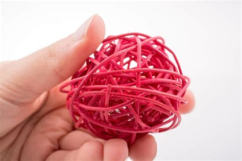 Premium Photo Roll Of Colotful String In Hand