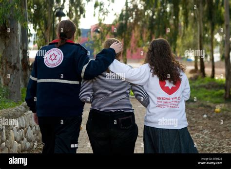 A Paramedic Of Magen David Adom Emergency Service Hugs An Israeli