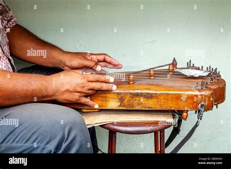 Plucking an instrument hi-res stock photography and images - Alamy