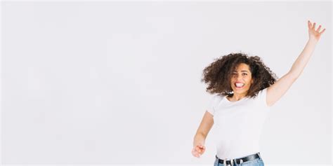 Free Photo Cheerful Brunette Jumping Andd Looking At Camera