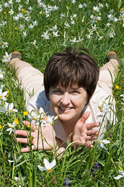 Beautiful Mature Woman Is Lying On The Grass Ad Resting Stock Photo Image Of Joyful Grass