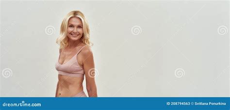 Beautiful At Any Age Happy Gorgeous Middle Aged Blonde Woman In Lingerie Smiling At Camera