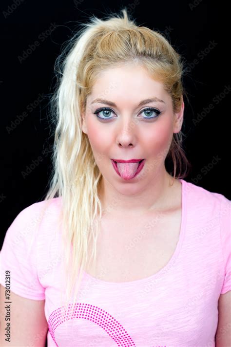 Blonde Frau Mit Ausgestreckter Zunge Stock Foto Adobe Stock