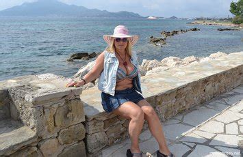 Milf Chrissy Takes A Naturist Vacation To Greece And Shows Off Her Big Tits Photos