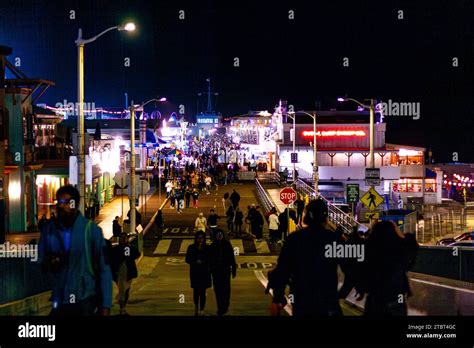 Tourists Walking Down Santa Monica Pier At Night In Santa Monica