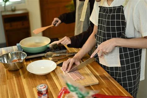 Close Up Of A Gay Couple Preparing A Meal In The Kitchen Stock Photo Image Of Friendship Lgbt