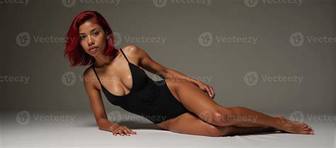 A Sultry Redhead Poses Seductively In A Bedroom In Just Lingerie 51677115 Stock Photo At Vecteezy