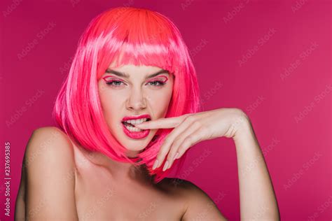 Fashionable Naked Girl In Neon Pink Wig Biting Finger Isolated On Pink Stock Photo Adobe Stock