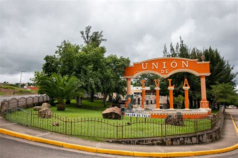 Orange Archway With An Iron Gate Leads To Union Park Editorial