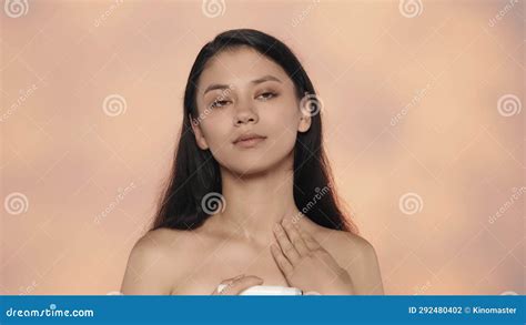 Closeup Studio Shot Of Beautiful Female Model Brunette Girl With Long Hair And Nude Makeup