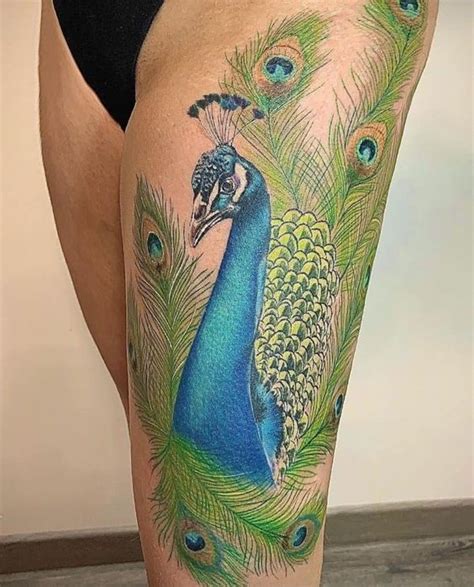 Peacock Tattoos On The Thigh 10 Designs Of Grace And Beauty