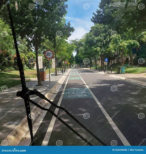 Traveling by Electric Vehicle on Empty Streets with Bicycle Lanes Stock