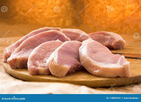 Fresh Raw Pork Chops On A Cutting Board Arrangement On The Wr Stock