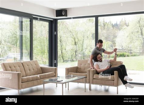 Gay Couple Love Home Concept Gay Couple Enjoying Leisure Time In Living Room Stock Photo Alamy