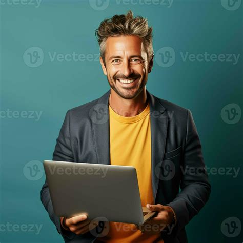 Portrait Of A Smiling Mature Man Using Laptop 27569725 Stock Photo At