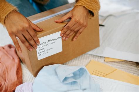 Woman preparing box with parcel for sending · Free Stock Photo