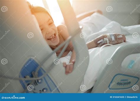 Smiling Kid Girl in Hospital Bed Stock Image - Image of happy ...