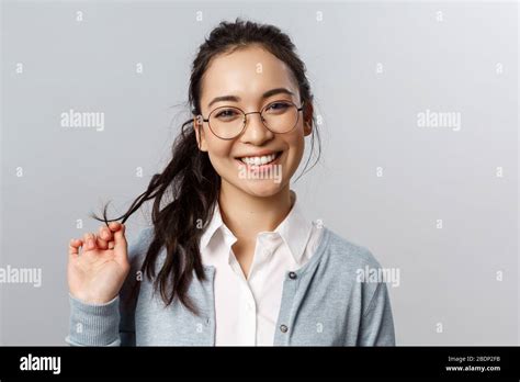 Close Up Portrait Of Flirty Enthusiastic Brunette Asian Female In Glasses Beaming Smile Roll