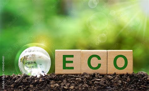 Words ECO on wooden cubes on green sunny background. save clean planet ...