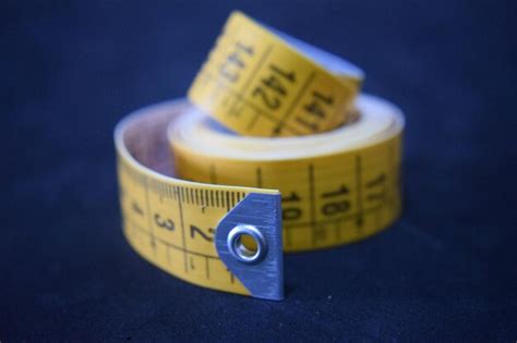 Premium Photo Close Up Of Tape Measure On Table