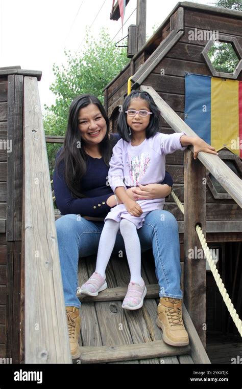 Latina Divorced Single Mom And Brunette Year Old Daughter With Glasses Play In Outdoor Park