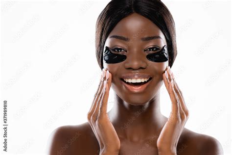 African American Naked Woman With Hydrogel Eye Patches On Face Isolated On White Stock Photo