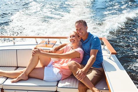 Treating Themselves To A Romantic Boat Ride A Mature Couple Enjoying A Relaxing Boat Ride