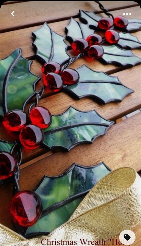 Stained Glass Christmas Decorations On A Wooden Table