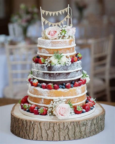 Beautiful Naked Wedding Cake With Flowers And Berries