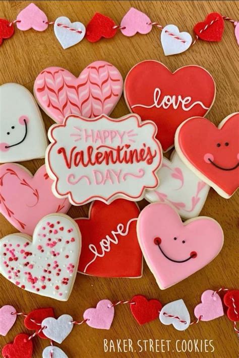 Valentine S Day Cookies Are Arranged On A Table