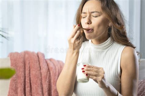 Young Woman Eating Yogurt at Home. Healthy Diet Nutrition Stock Photo ...