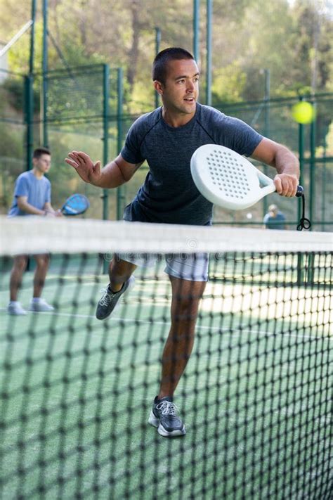 Male Players Playing Padel in a Padel Court Outdoor Behind Net Stock ...